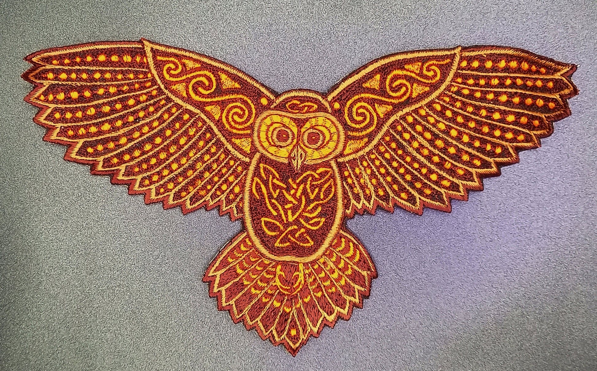 Celtic Owl Patch Embroidery with blacklight glowing UV colors - beautiful owl flies high and watches through the night of the magic forest